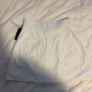 TNA Slick Court Mini Skirt — White (XS) — Brand New With Tags